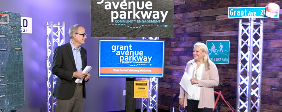 a man and women hosting a virtual input event on a video set